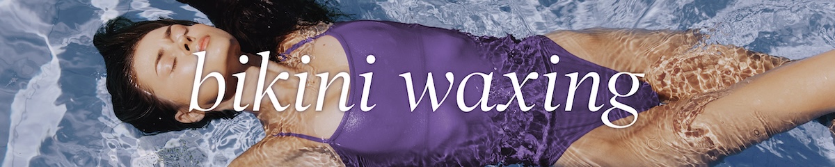 Bikini-clad woman at the beach modeling bikini waxing